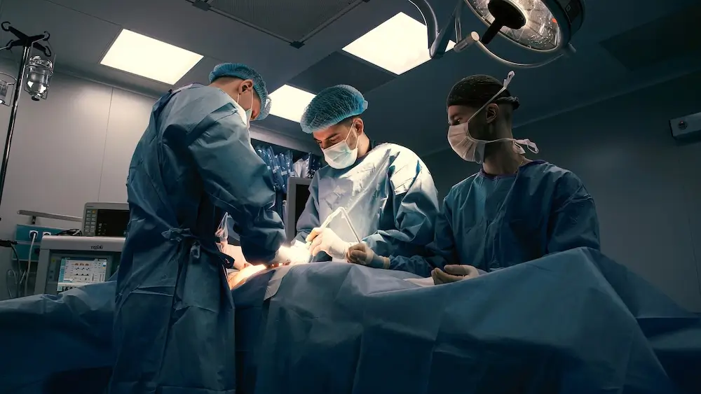 Ambulatory 1 Surgical team performing a procedure in a modern operating room